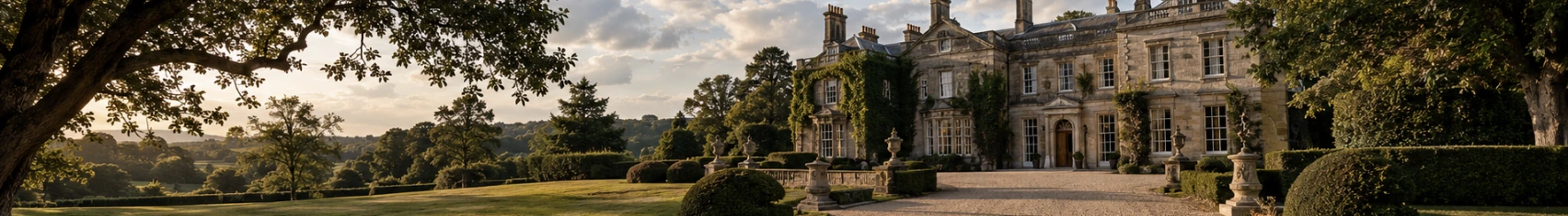 A stone country house with formal gardens and parkland