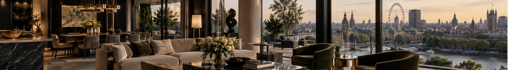 A London penthouse living room overlooking the Thames at dusk